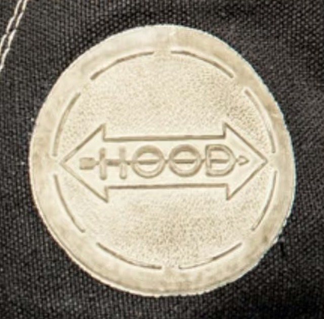 The white rubber disc at the ankle of the 1955 Conference, the double arrow debossed through the name