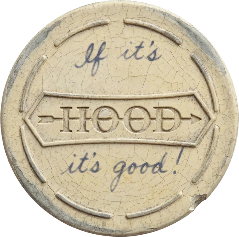 The Hood lateral patch: an aged white rubber disc, the double-headed arrow banner reading HOOD pressed into its face, with the words If it’s above and it’s good! below in blue handwriting