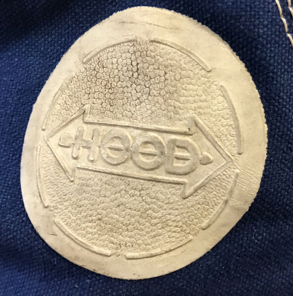 The Hood arrow, embossed — Hood Rubber Company archive