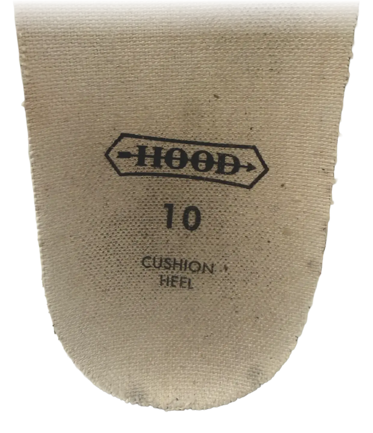 The removed cream canvas sock liner of a 1955 Hood Conference, stamped with the double-headed Hood arrow, the size 10, and the words CUSHION HEEL.